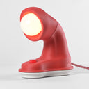 The short Nessi table lamp in Coral