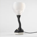 A picture of Nimbus, a modern table lamp with translucent shade and Charcoal base on a white background