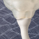 A close up of the Translucent shade of the Nimbus lamp in Putty.